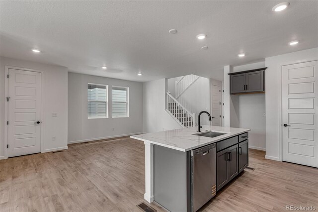 1415 Great Western Dr, Longmont, CO 80501 - kitchen with a sink, stainless steel dishwasher, light wood-style floors, baseboards, and recessed lighting