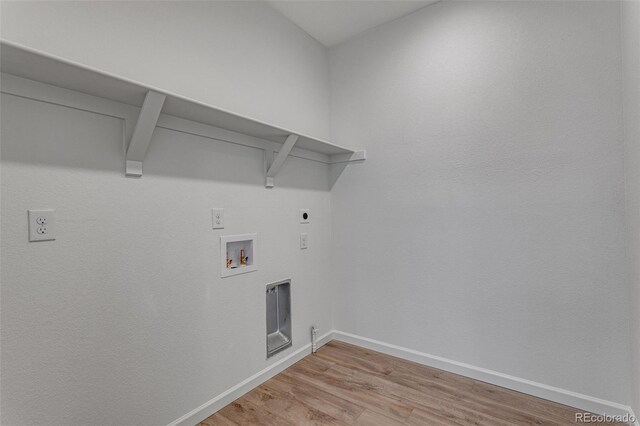 1415 Great Western Dr, Longmont, CO 80501 - clothes washing area with hookup for an electric dryer, light wood-style flooring, washer hookup, and baseboards