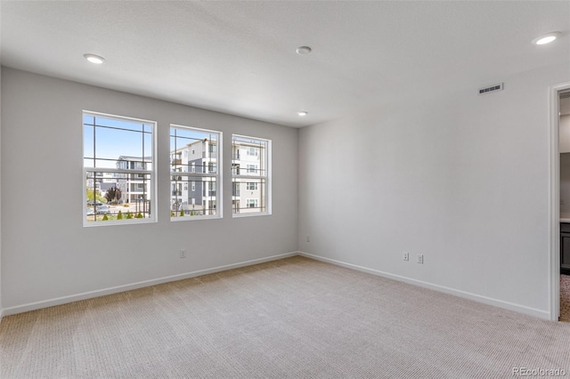 1415 Great Western Dr, Longmont, CO 80501 - unfurnished room with light colored carpet, healthy amount of natural light, baseboards, and recessed lighting