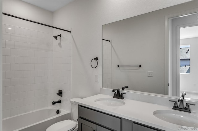 1415 Great Western Dr, Longmont, CO 80501 - bathroom featuring washtub / shower combination, toilet, and double vanity