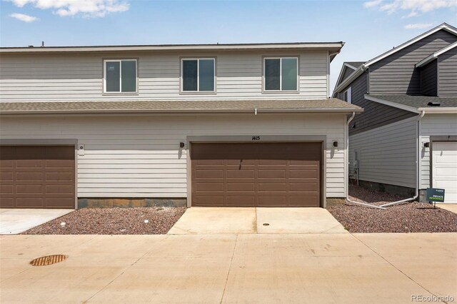 1415 Great Western Dr, Longmont, CO 80501 - view of front of home featuring an attached garage and driveway