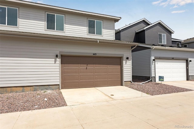 1415 Great Western Dr, Longmont, CO 80501 - view of front of home featuring a garage and concrete driveway