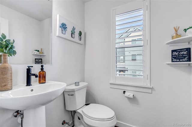 bathroom featuring toilet and sink