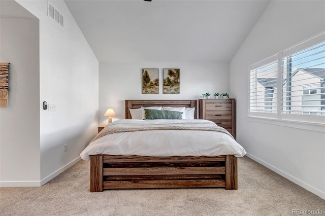 carpeted bedroom featuring vaulted ceiling