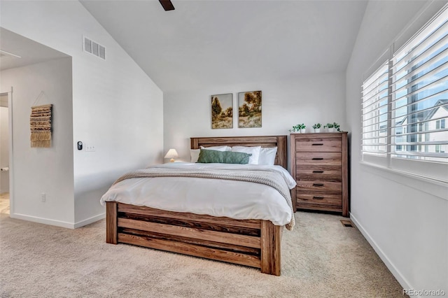 carpeted bedroom featuring lofted ceiling and ceiling fan