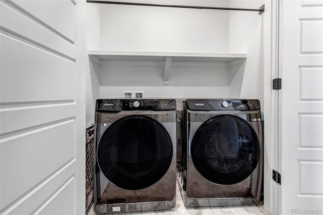 washroom with separate washer and dryer