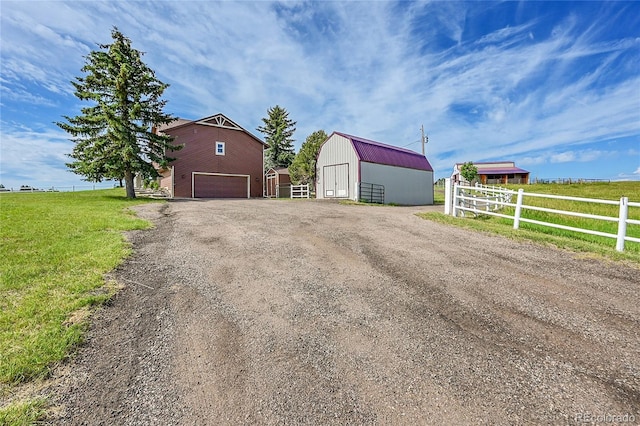 35675 Cheyenne Trl, Elizabeth, CO 80107 - view of pole building featuring driveway and a garage