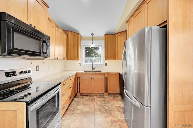 35675 Cheyenne Trl, Elizabeth, CO 80107 - kitchen featuring stainless steel appliances, light countertops, light stone finish floors, hanging light fixtures, and light brown cabinetry