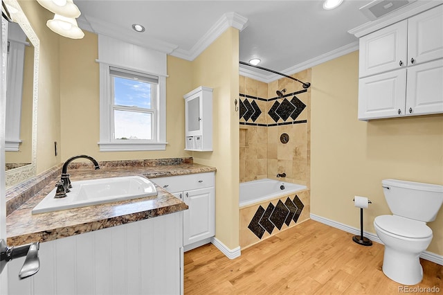 35675 Cheyenne Trl, Elizabeth, CO 80107 - full bathroom with crown molding, wood finished floors, vanity, tiled shower / bath combo, and recessed lighting