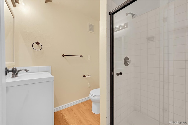 35675 Cheyenne Trl, Elizabeth, CO 80107 - bathroom with a shower stall, vanity, and wood finished floors