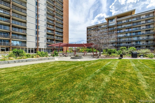 surrounding community with a yard