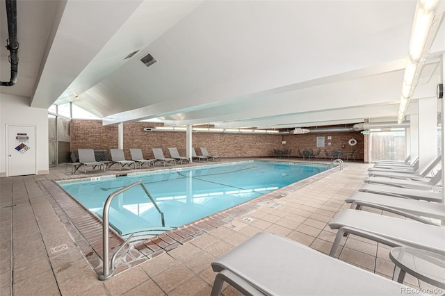 indoor pool with a patio