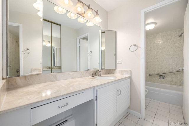 bathroom featuring tile patterned floors, vanity, toilet, and shower / bathtub combination