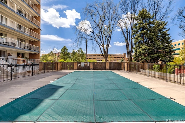 community pool featuring fence