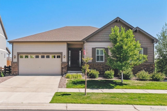 view of front facade featuring a garage, stone siding, and concrete driveway