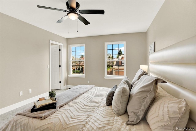 bedroom featuring baseboards and a ceiling fan