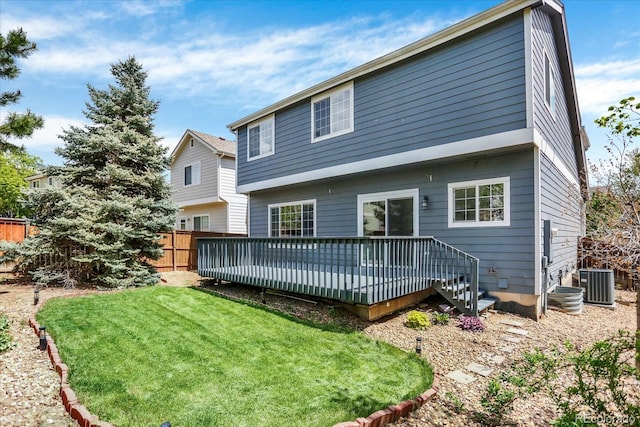 back of property featuring cooling unit and a wooden deck