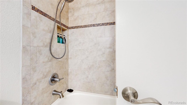 interior details featuring bathtub / shower combination