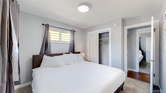 bedroom with a closet and baseboards