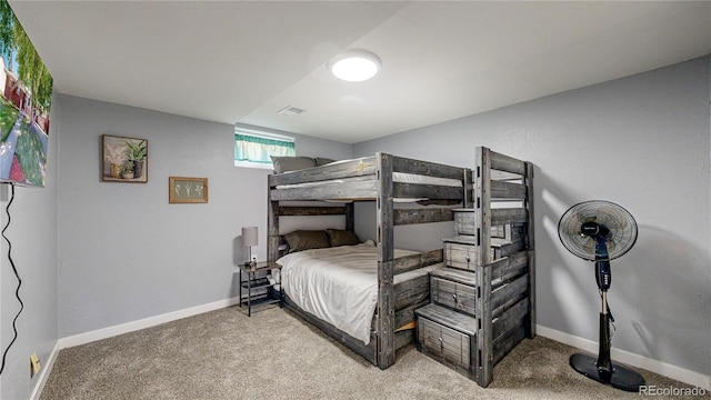 bedroom with light carpet, visible vents, and baseboards