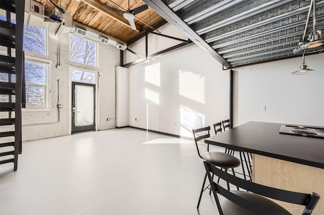 interior space featuring ceiling fan and wooden ceiling