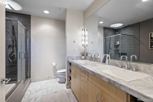 1401 Delgany St Unit 203, Denver, CO 80202 - full bathroom featuring double vanity, a shower stall, marble look tile flooring, and recessed lighting