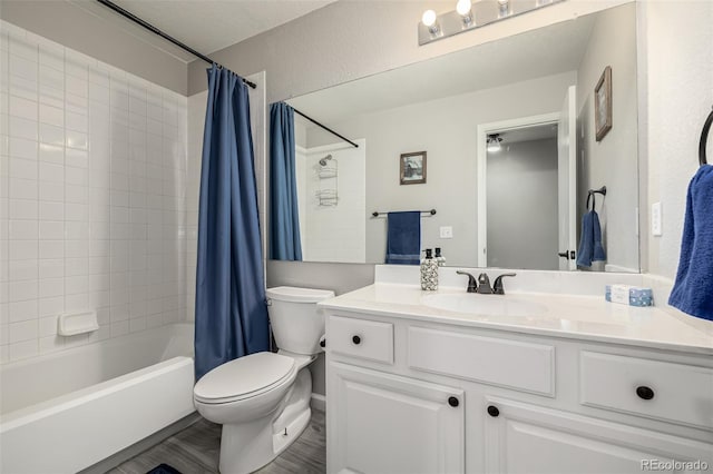 full bathroom with vanity, toilet, shower / tub combo, and hardwood / wood-style floors