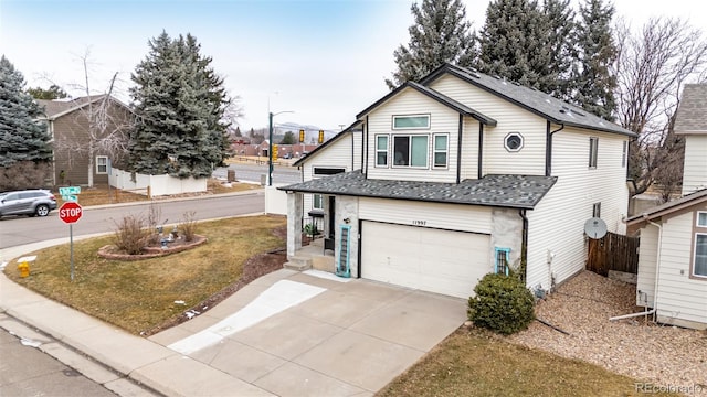 front of property featuring a garage and a front yard