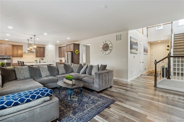 6616 Amur Ln, Castle Rock, CO 80108 - living area with stairway, light wood-style flooring, recessed lighting, and baseboards