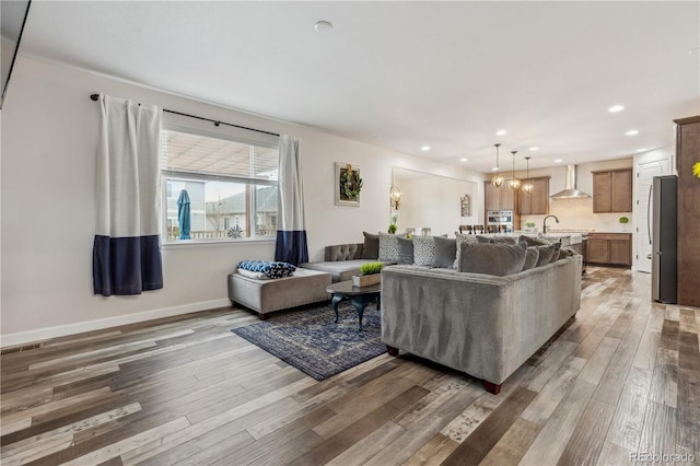 6616 Amur Ln, Castle Rock, CO 80108 - living room with light wood-style flooring, recessed lighting, and baseboards