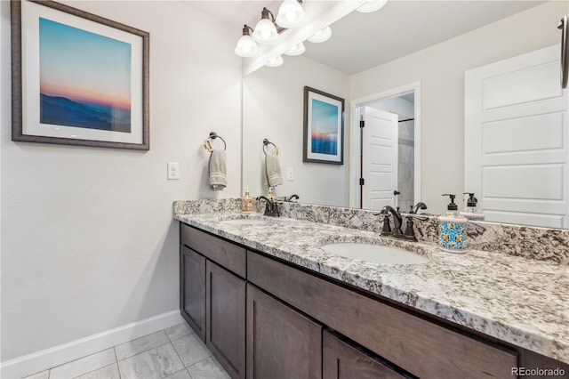 6616 Amur Ln, Castle Rock, CO 80108 - bathroom with baseboards, marble look tiles, and double vanity