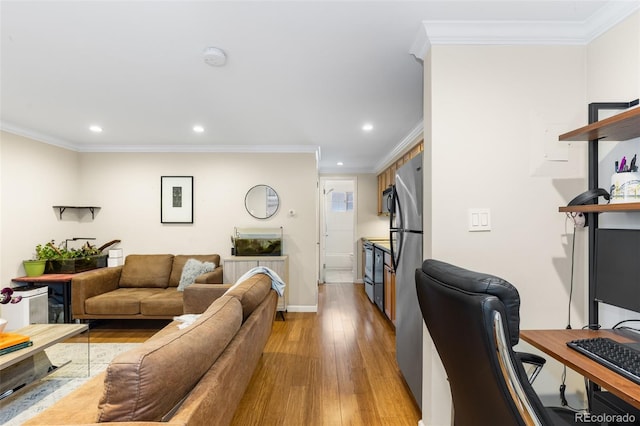 living room featuring crown molding and light wood-type flooring