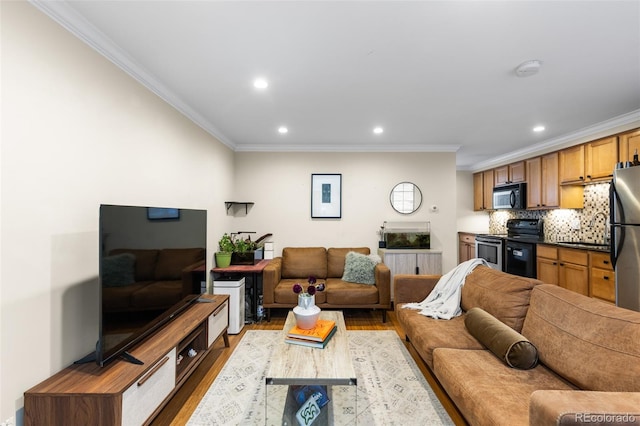 living room featuring crown molding and light wood-type flooring