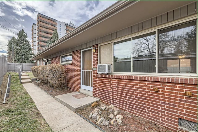 4585/4587 E Yale Ave, Denver, CO 80222 - entrance to property featuring brick siding and cooling unit