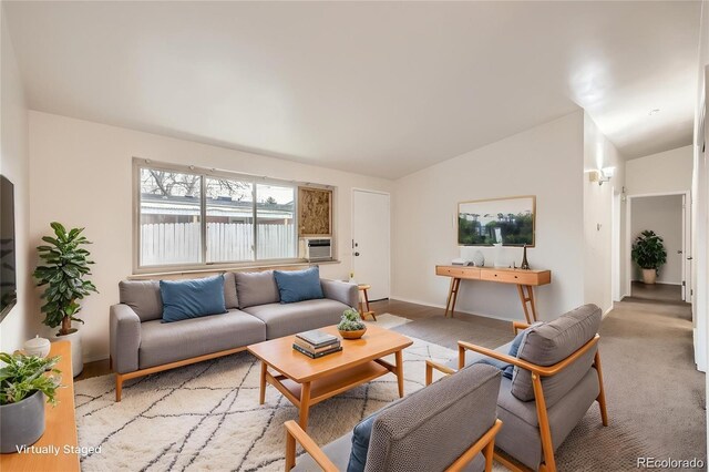 4585/4587 E Yale Ave, Denver, CO 80222 - living area featuring vaulted ceiling and baseboards