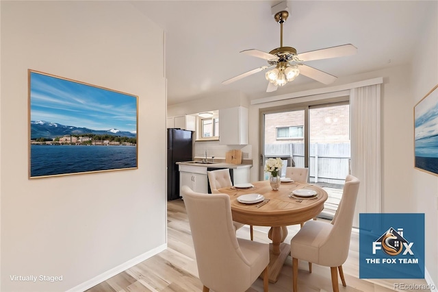 4585/4587 E Yale Ave, Denver, CO 80222 - dining space featuring light wood finished floors, a ceiling fan, baseboards, and a mountain view