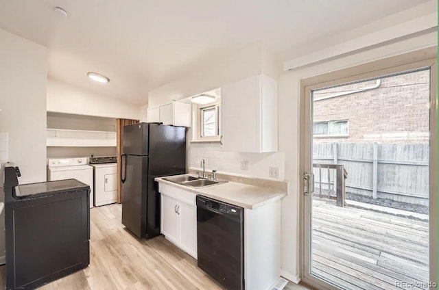 4585/4587 E Yale Ave, Denver, CO 80222 - kitchen with black appliances, a sink, washer and clothes dryer, white cabinetry, and light wood-type flooring