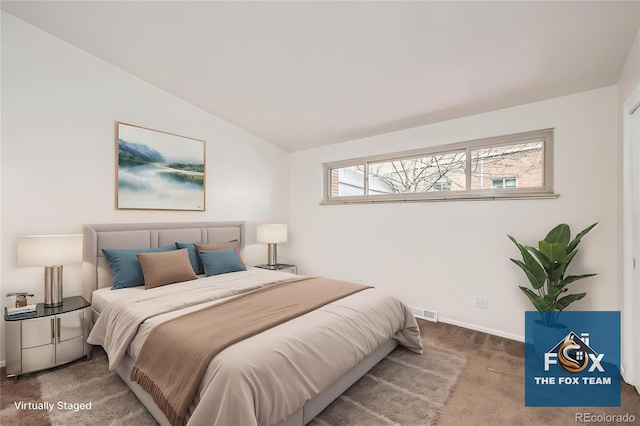 4585/4587 E Yale Ave, Denver, CO 80222 - bedroom featuring carpet floors, vaulted ceiling, and baseboards