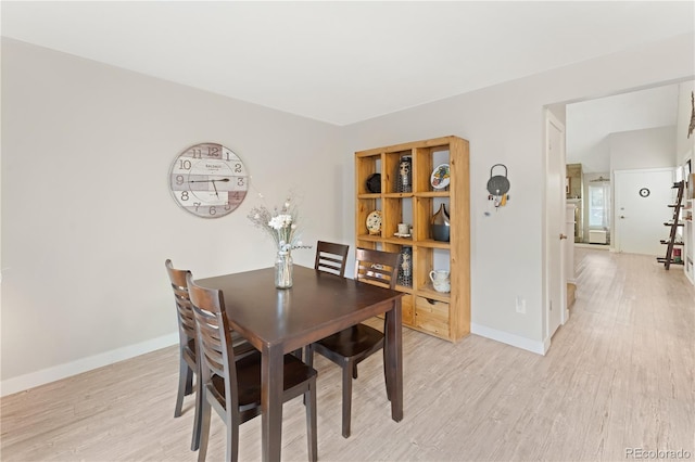 dining space featuring light hardwood / wood-style floors