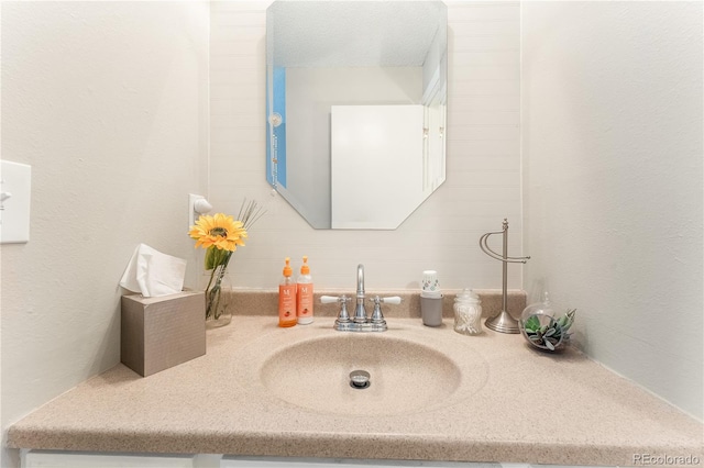 bathroom featuring vanity and a textured ceiling