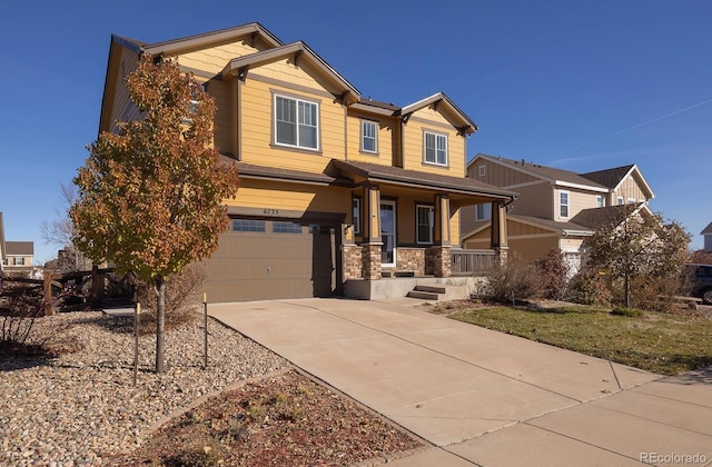 craftsman house with a porch and a garage