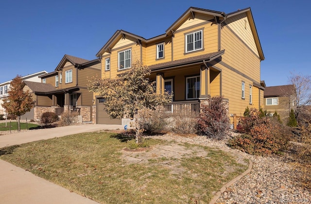 craftsman-style home featuring covered porch and a garage