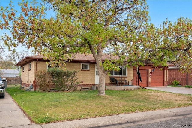 view of front of house featuring brick siding, driveway, and a garage