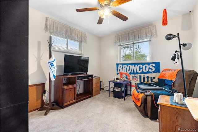 living room featuring light colored carpet and ceiling fan