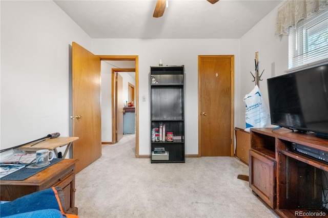 bedroom with light colored carpet and ceiling fan