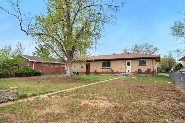 back of house featuring brick siding