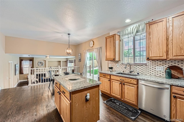 4037 S Odessa Cir, Aurora, CO 80013 - kitchen with a sink, dishwasher, a textured ceiling, backsplash, and dark wood-style floors