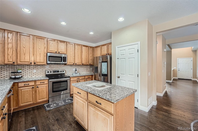 4037 S Odessa Cir, Aurora, CO 80013 - kitchen featuring appliances with stainless steel finishes, tasteful backsplash, light stone counters, and dark wood-type flooring