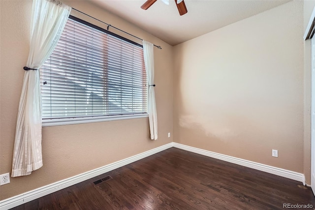 4037 S Odessa Cir, Aurora, CO 80013 - unfurnished room with visible vents, a ceiling fan, baseboards, and dark wood-type flooring