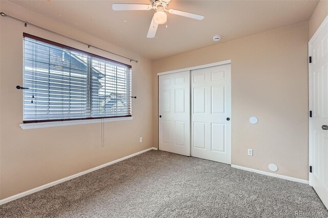 4037 S Odessa Cir, Aurora, CO 80013 - unfurnished bedroom featuring baseboards, ceiling fan, carpet, and a closet